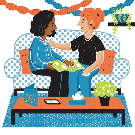 Illustration of two women sitting together on a polka-dot sofa looking at a book, with paper-chain garlands and a plant in the background