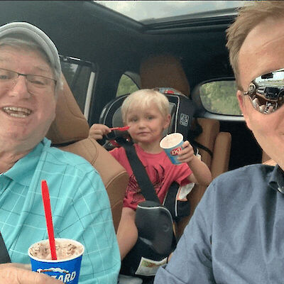 Three generations of Cullens. Mark, with his son and dad enjoying a tasty treat