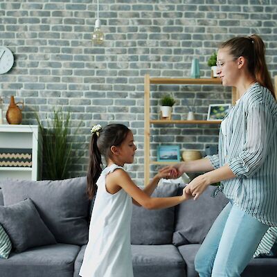 Mother and daughter dancing