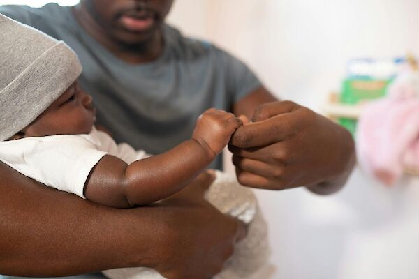 Man holding baby