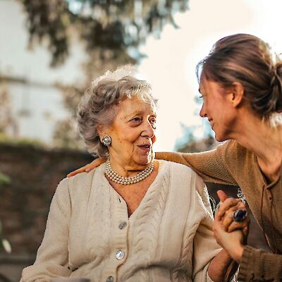 Old and young women embracing