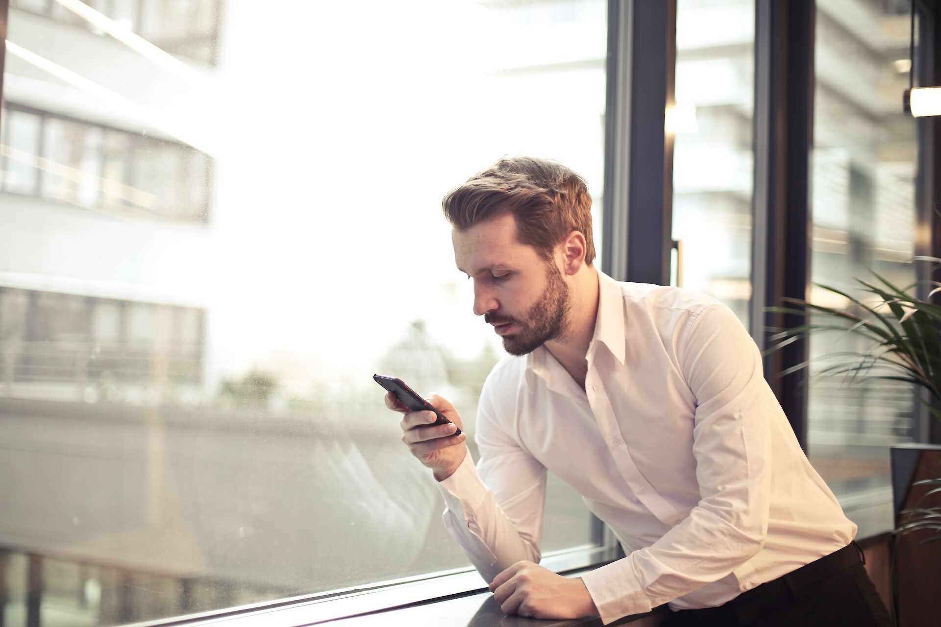 man looking at phone