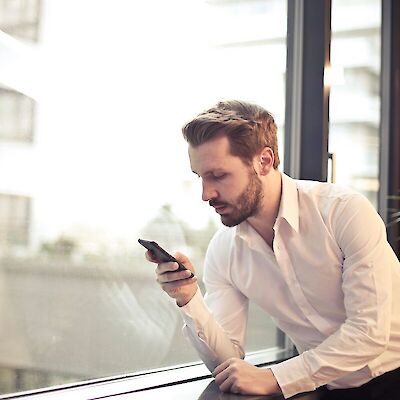man looking at phone