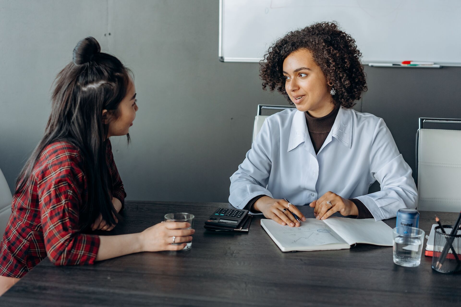 Manager talking with grieving employee at work
